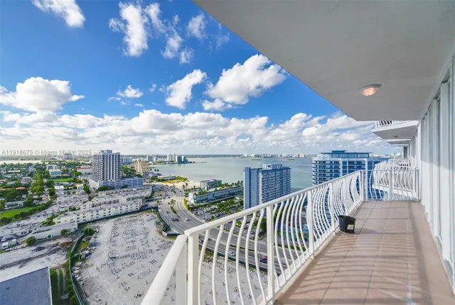 a view of a balcony with city view