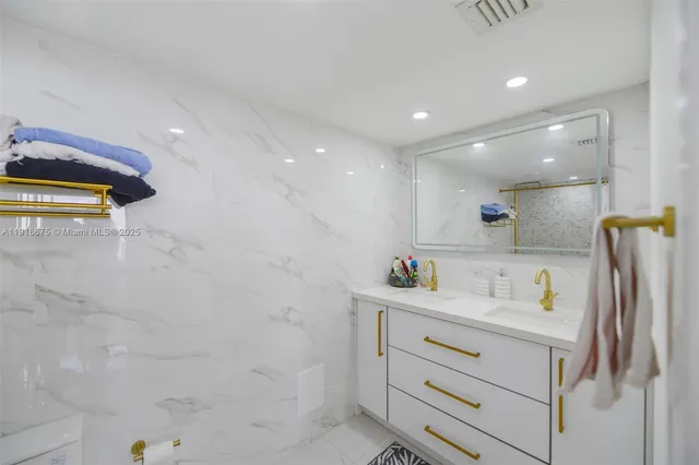 a bathroom with a sink a vanity and mirror