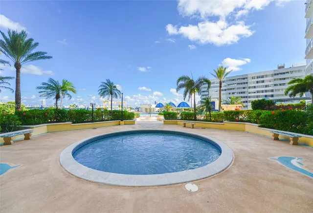 a view of a swimming pool with a patio