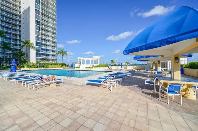 a view of a patio with a table and chairs