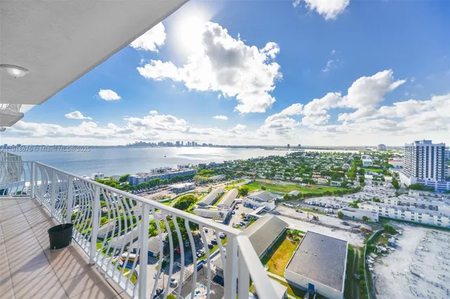 a view of a balcony with furniture