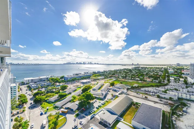 a view of a city with an ocean