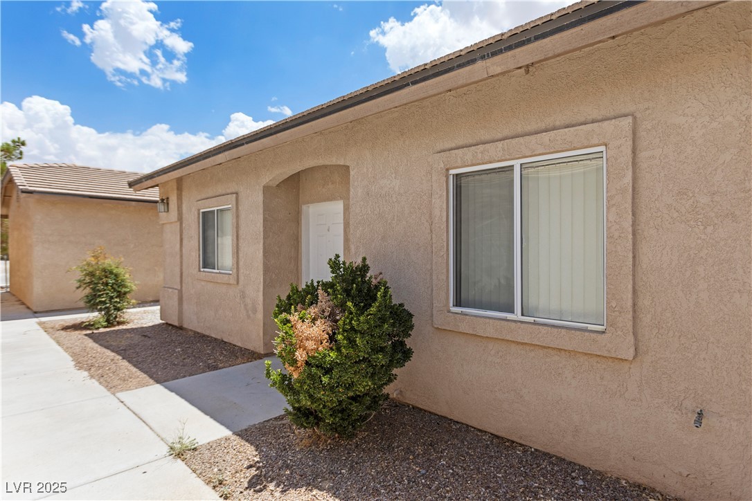 1430 Star Road Pahrump, NV 89048 - Photo 5 of 32 Property entrance featuring stucco siding and a patio