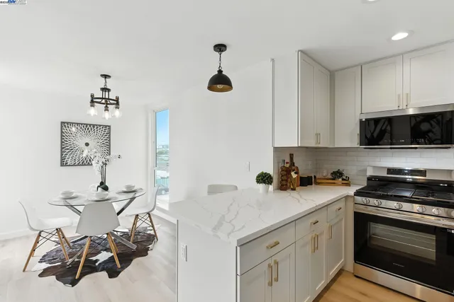 a kitchen with a sink cabinets and stainless steel appliances