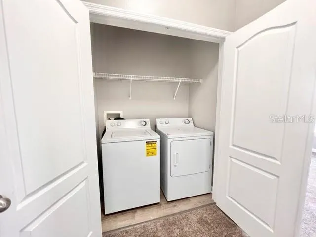 a utility room with dryer and washer