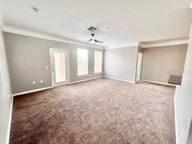 a view of an empty room with a window