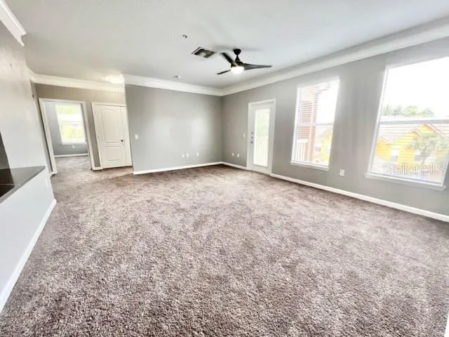 an empty room with windows and closet