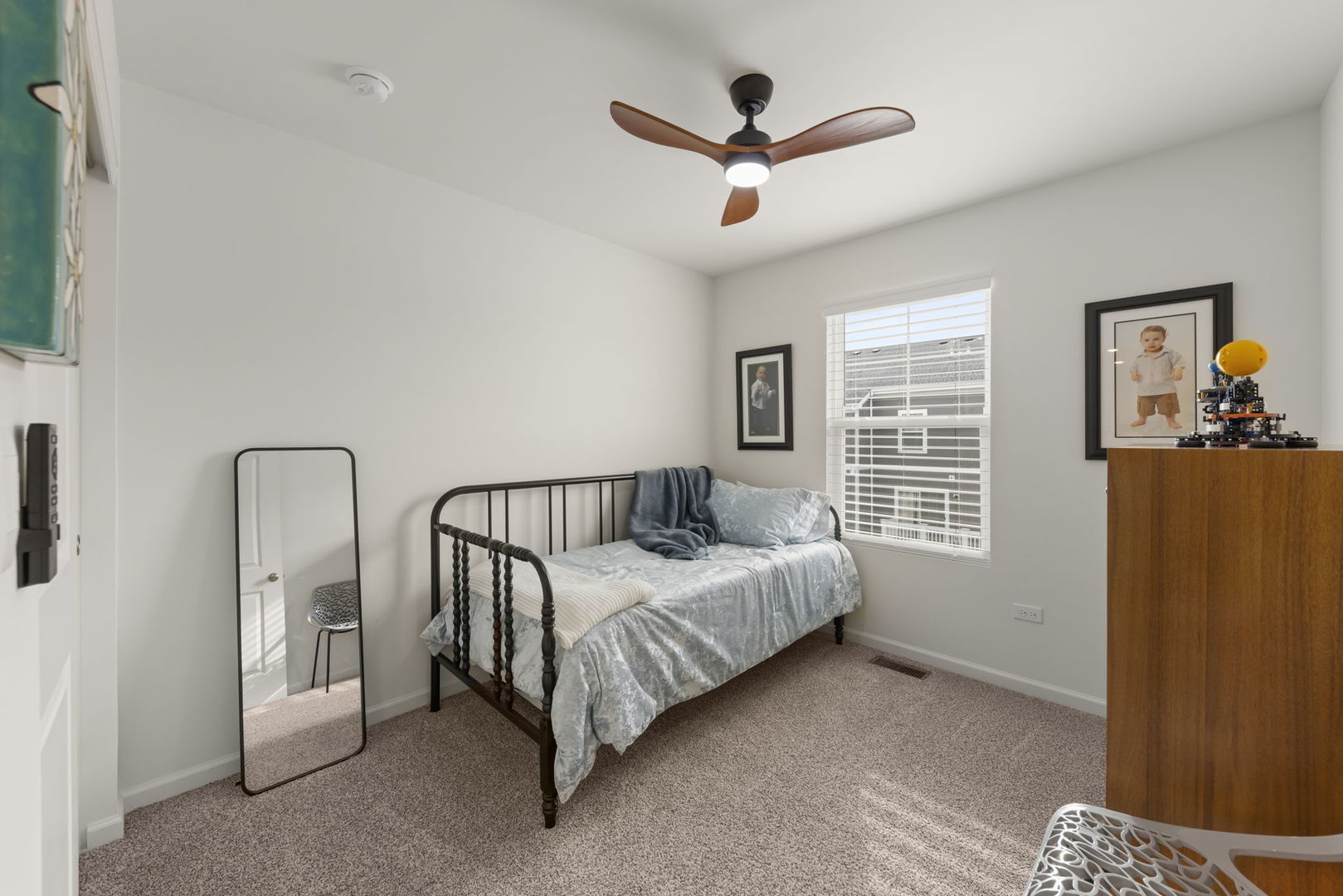 352 Bridgeview Court St. Charles, IL 60174 - Photo 16 of 20 a spacious bedroom with a bed a window and a ceiling fan