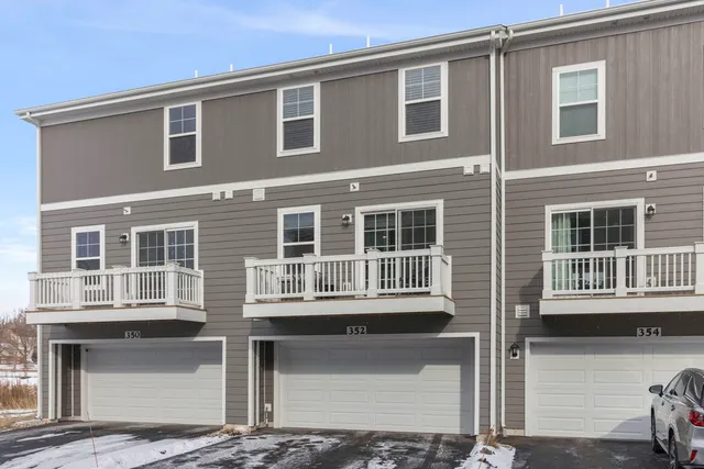 a front view of a house with many windows