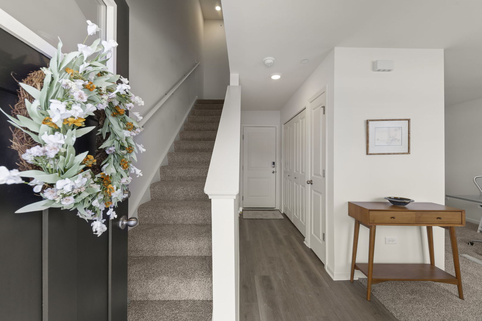 352 Bridgeview Court St. Charles, IL 60174 - Photo 2 of 20 a vase of flowers sitting on a floor with a table