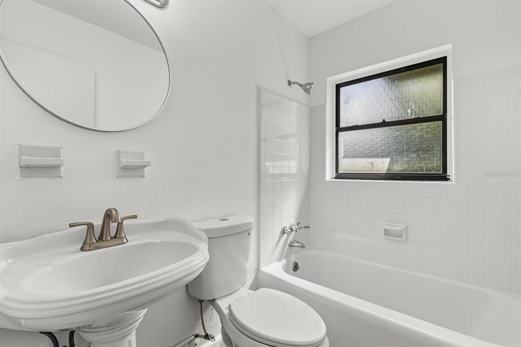 1816 Ivy Lane Winter Park, FL 32792 - Photo 11 of 35 a bathroom with a sink toilet and shower