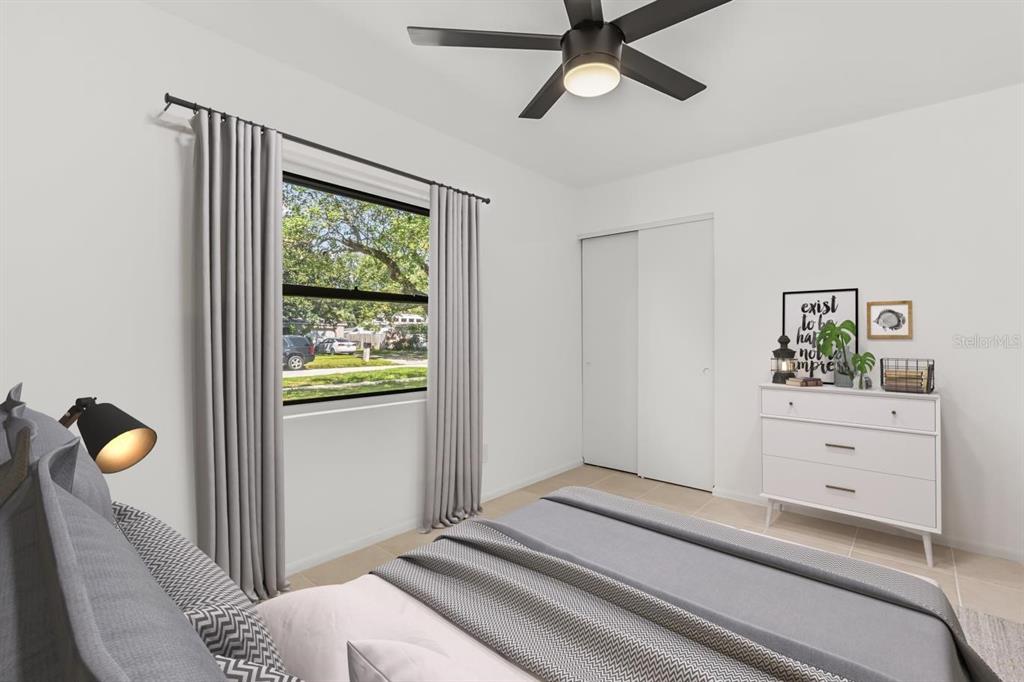 1816 Ivy Lane Winter Park, FL 32792 - Photo 12 of 35 a bedroom with a bed and a window