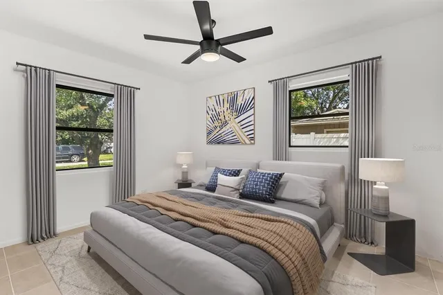 a bedroom with a large bed and a window