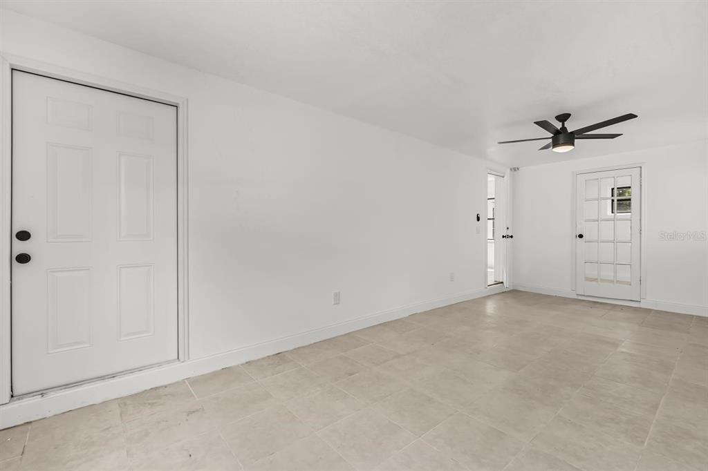 1816 Ivy Lane Winter Park, FL 32792 - Photo 16 of 35 an empty room with a ceiling fan and a window