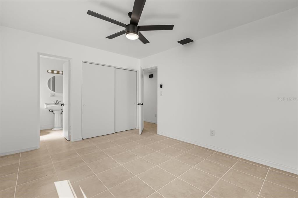 1816 Ivy Lane Winter Park, FL 32792 - Photo 18 of 35 a view of a livingroom with a ceiling fan & a window