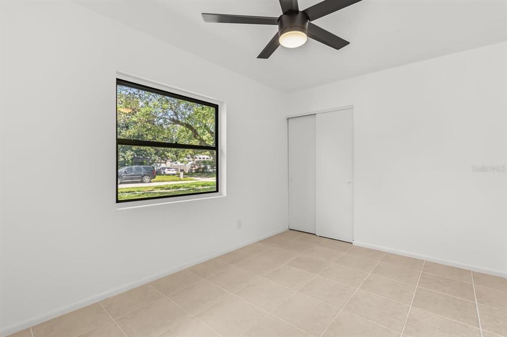 1816 Ivy Lane Winter Park, FL 32792 - Photo 19 of 35 an empty room with windows and fan