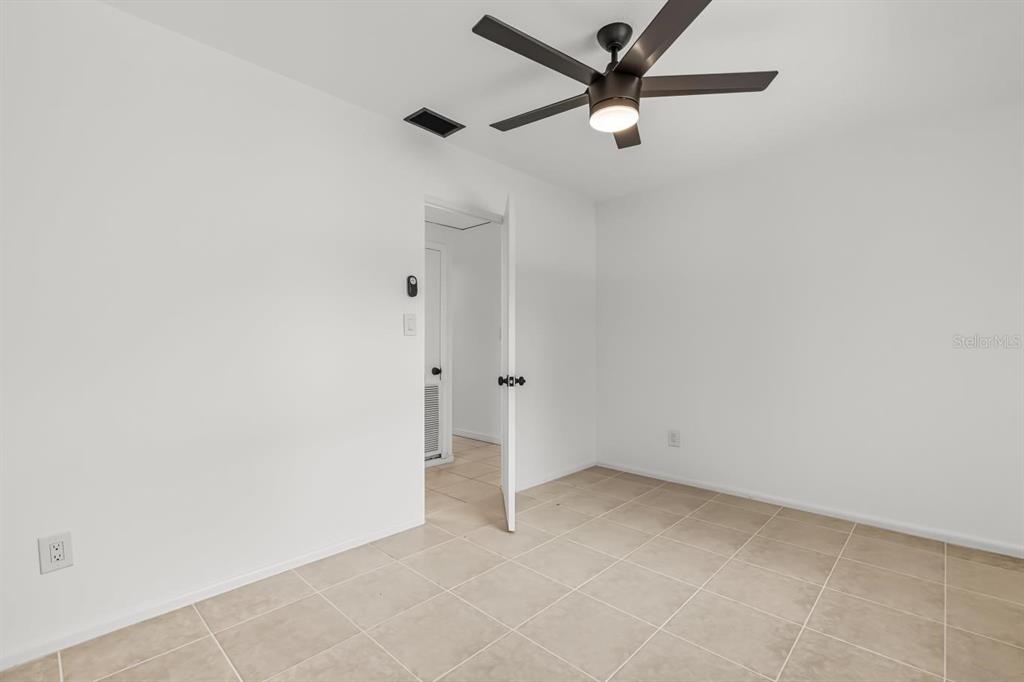 1816 Ivy Lane Winter Park, FL 32792 - Photo 20 of 35 an empty room with a ceiling fan and carpet