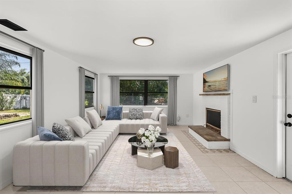 1816 Ivy Lane Winter Park, FL 32792 - Photo 4 of 35 a living room with furniture wooden floor and a fireplace