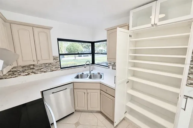 a kitchen with a sink and a window