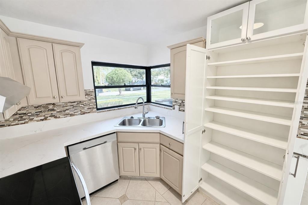 1816 Ivy Lane Winter Park, FL 32792 - Photo 9 of 35 a kitchen with a sink and a window