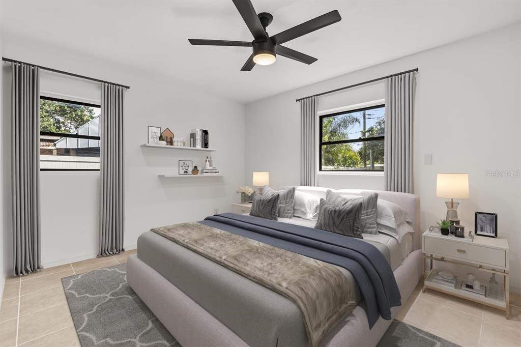 1816 Ivy Lane Winter Park, FL 32792 - Photo 10 of 35 a bedroom with a large bed and a window