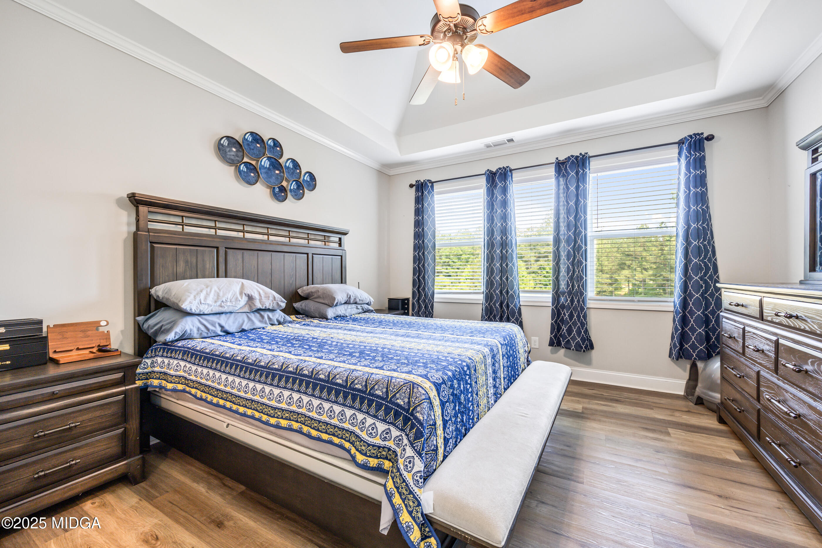 36 River Rapids Drive Forsyth, GA 31029 - Photo 16 of 57 a bedroom with a bed and a chandelier