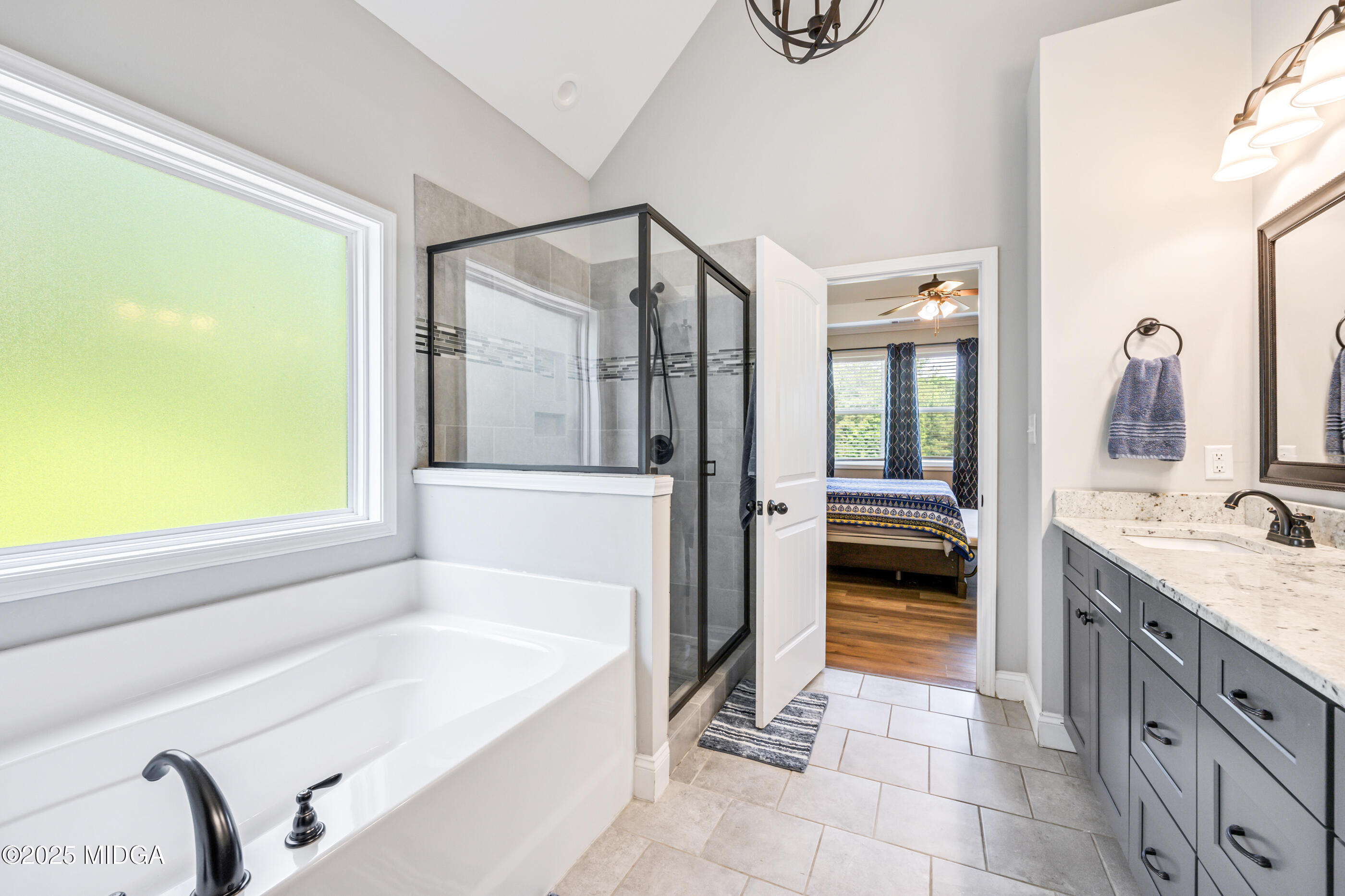 36 River Rapids Drive Forsyth, GA 31029 - Photo 19 of 57 a spacious bathroom with a tub sink and mirror