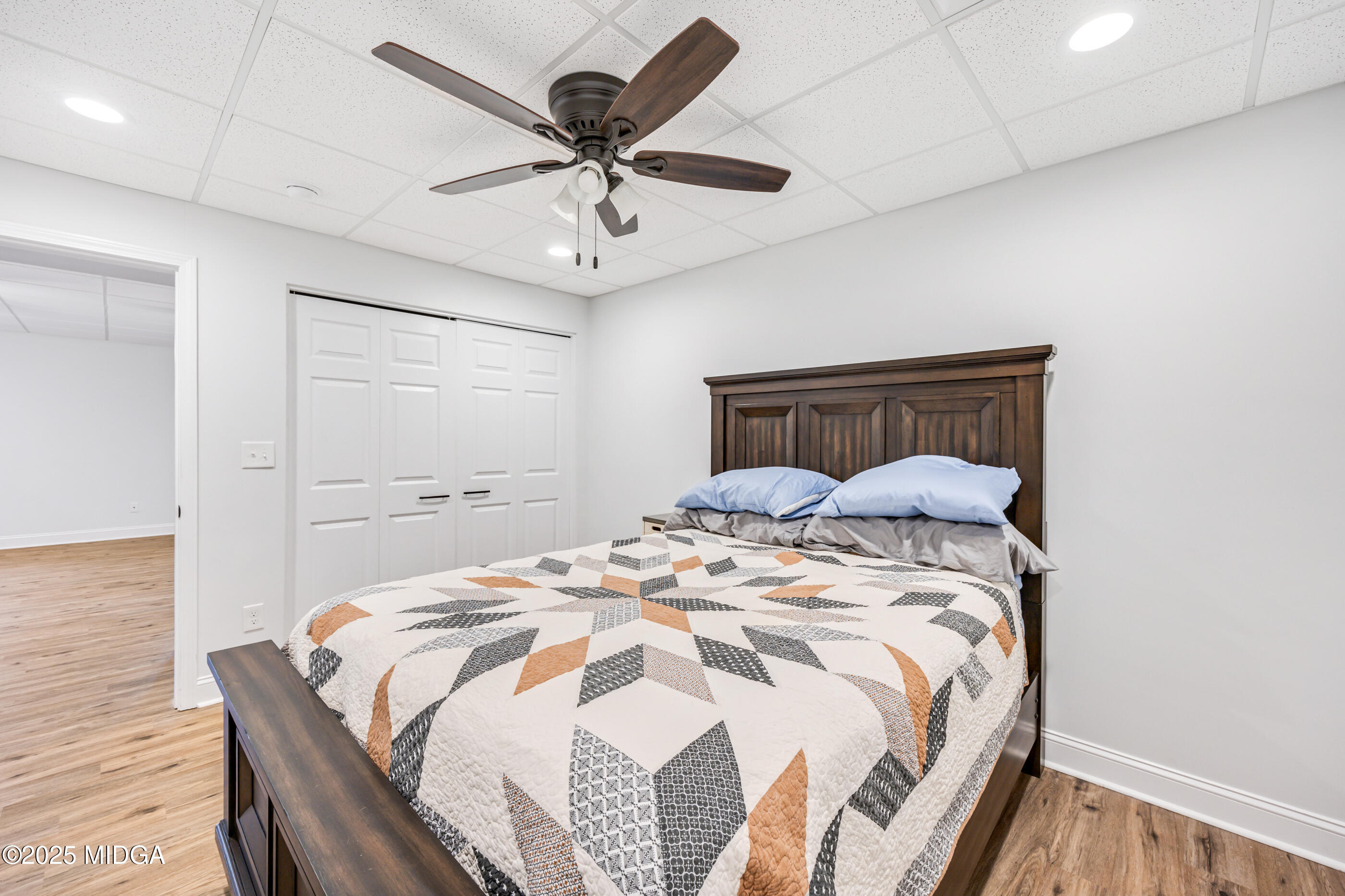 36 River Rapids Drive Forsyth, GA 31029 - Photo 35 of 57 a bedroom with a bed and a chandelier