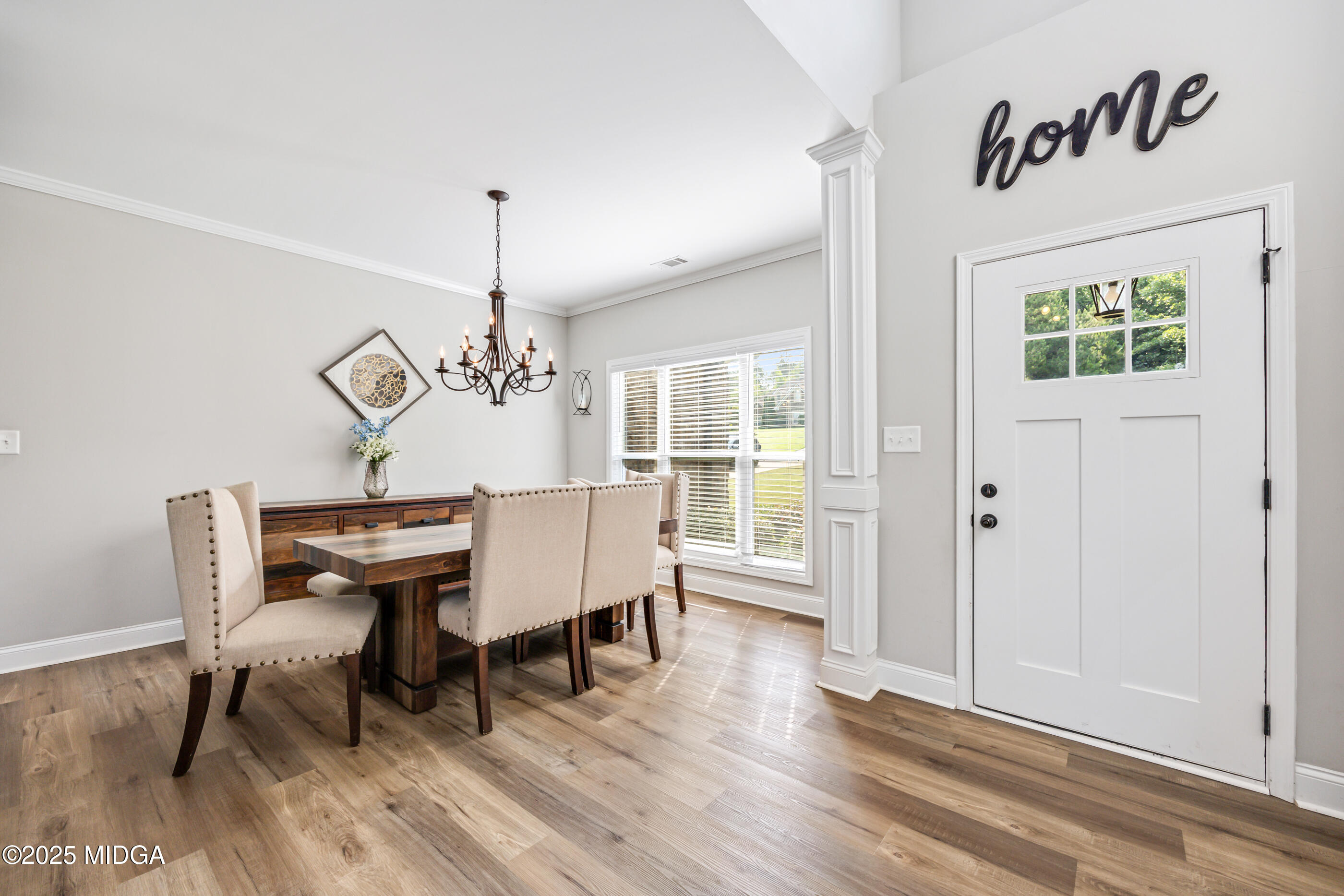 36 River Rapids Drive Forsyth, GA 31029 - Photo 4 of 57 a view of a dining room with furniture window and wooden floor