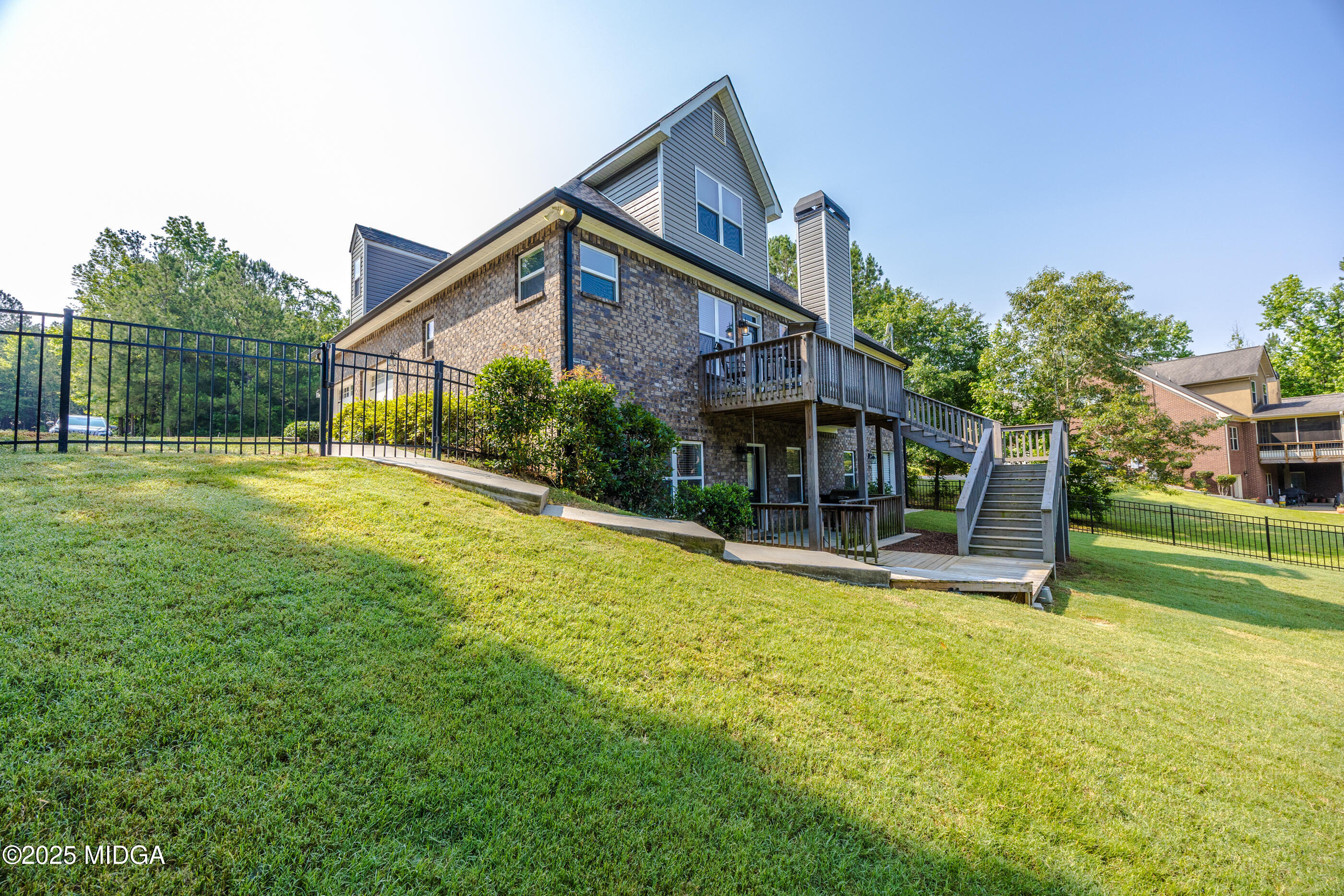 36 River Rapids Drive Forsyth, GA 31029 - Photo 42 of 57 a view of a house with a yard and sitting area