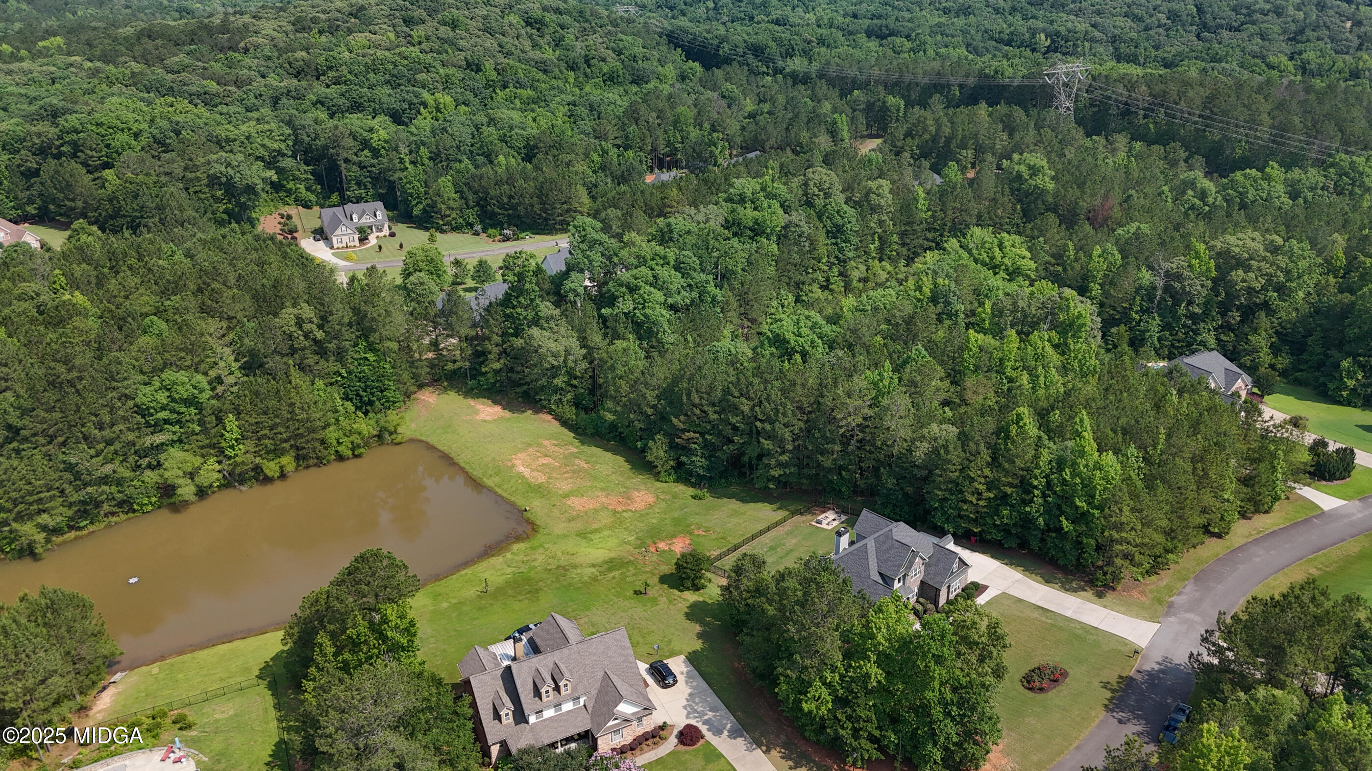 36 River Rapids Drive Forsyth, GA 31029 - Photo 50 of 57 an aerial view of a house with a yard and lake view