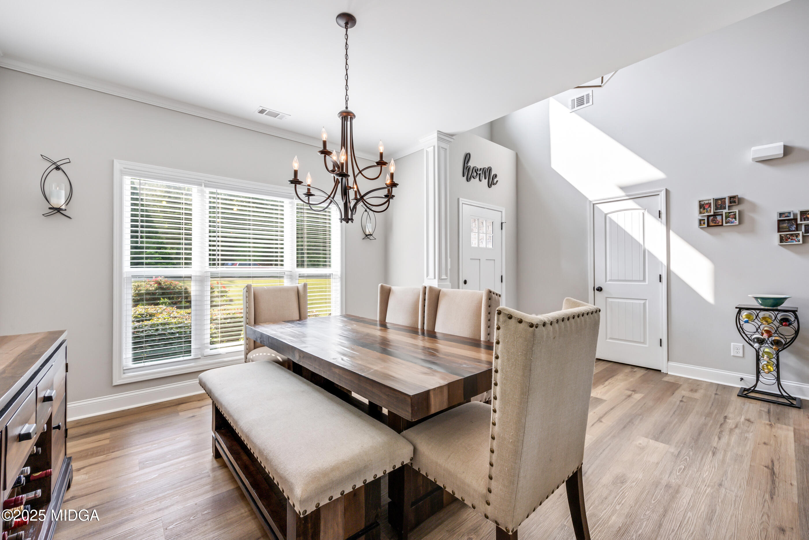 36 River Rapids Drive Forsyth, GA 31029 - Photo 5 of 57 a view of a dining room with furniture window and wooden floor