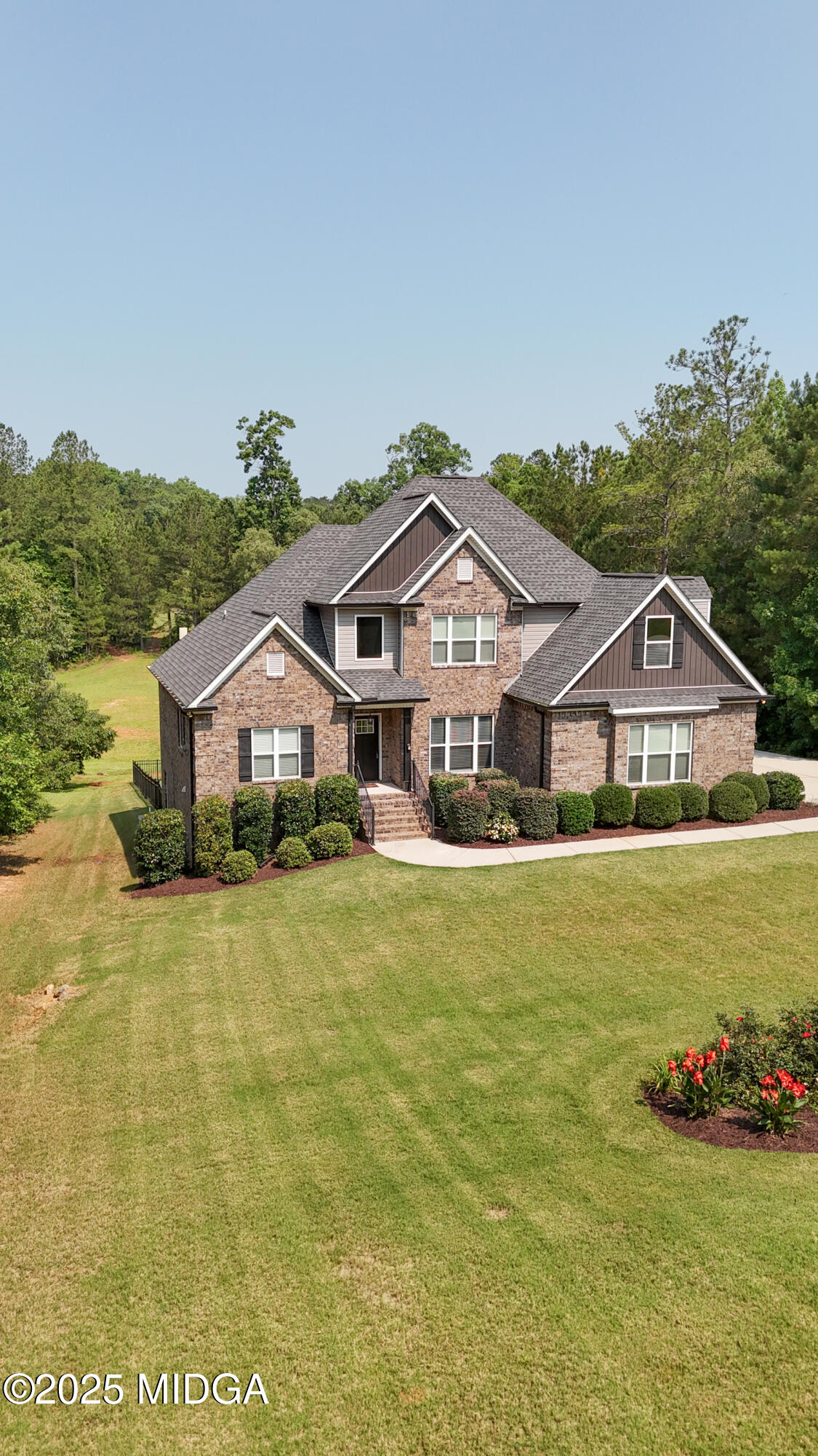 36 River Rapids Drive Forsyth, GA 31029 - Photo 56 of 57 a front view of a house with a garden
