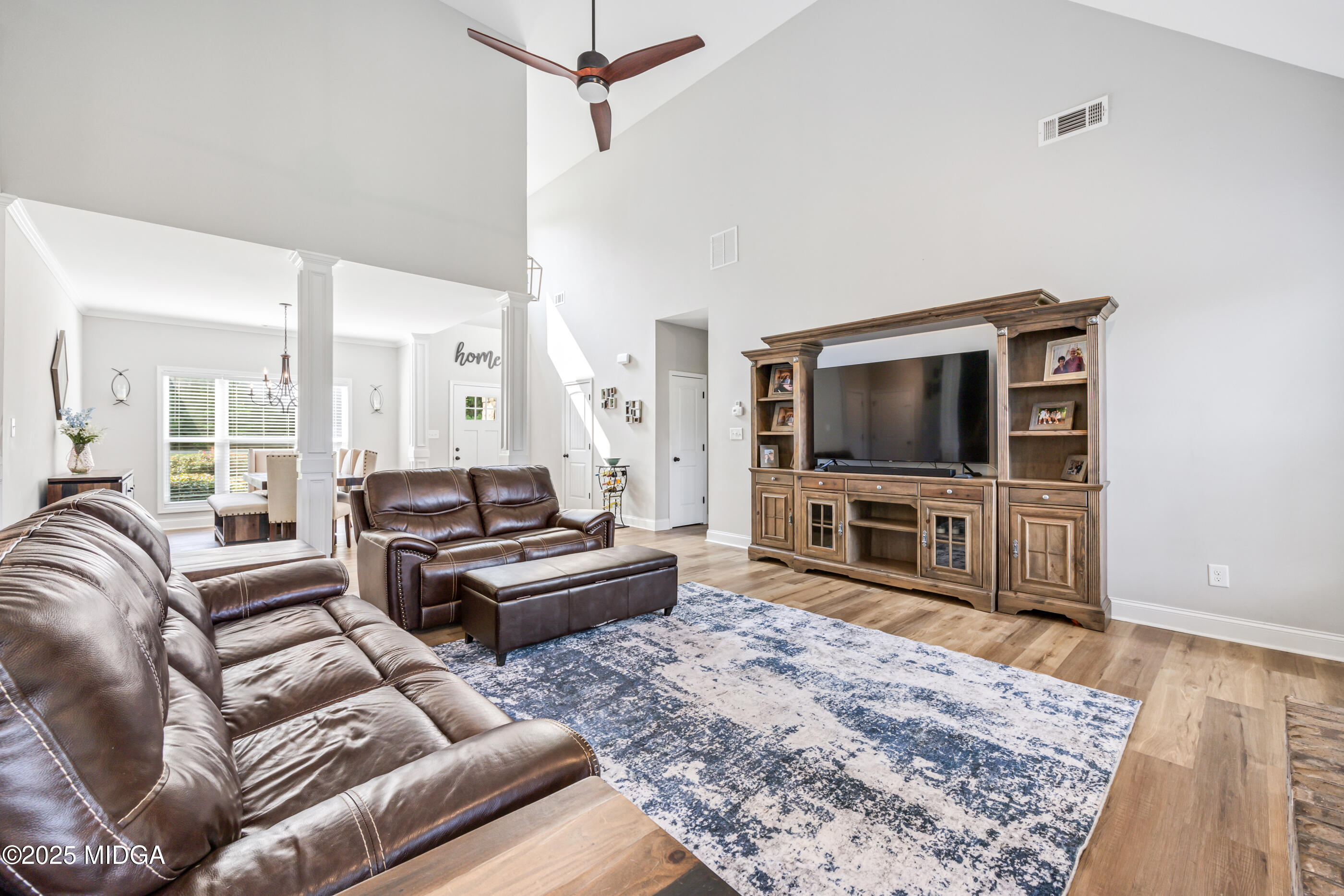 36 River Rapids Drive Forsyth, GA 31029 - Photo 8 of 57 a living room with furniture and a flat screen tv