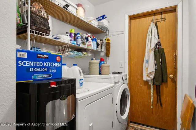a utility room with dryer and washer