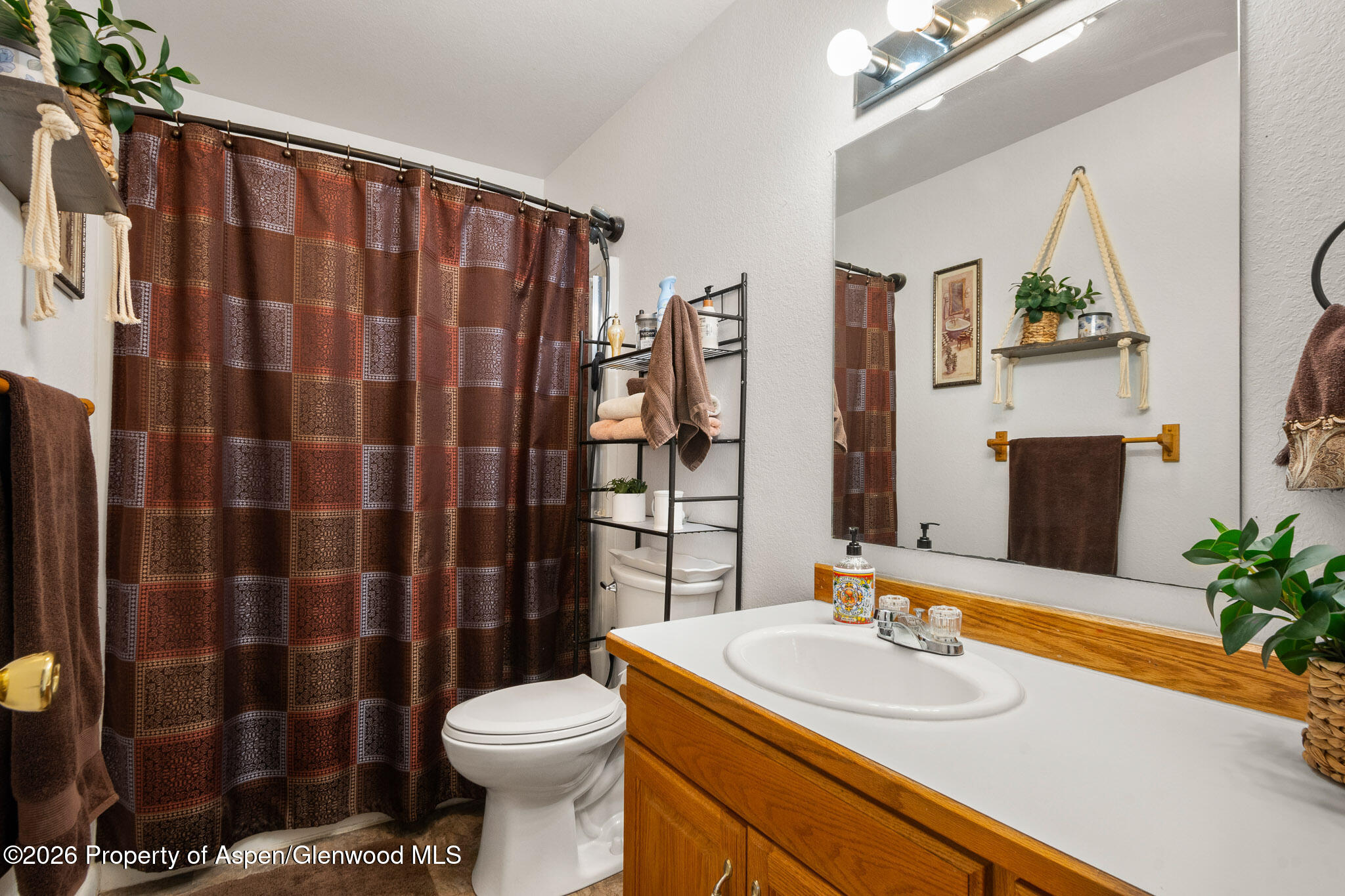 3127 Coal Mine Avenue Rifle, CO 81650 - Photo 18 of 21 a bathroom with a sink toilet and shower