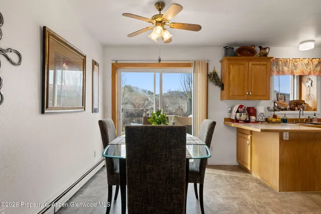 a view of a dining room with furniture window and outside view