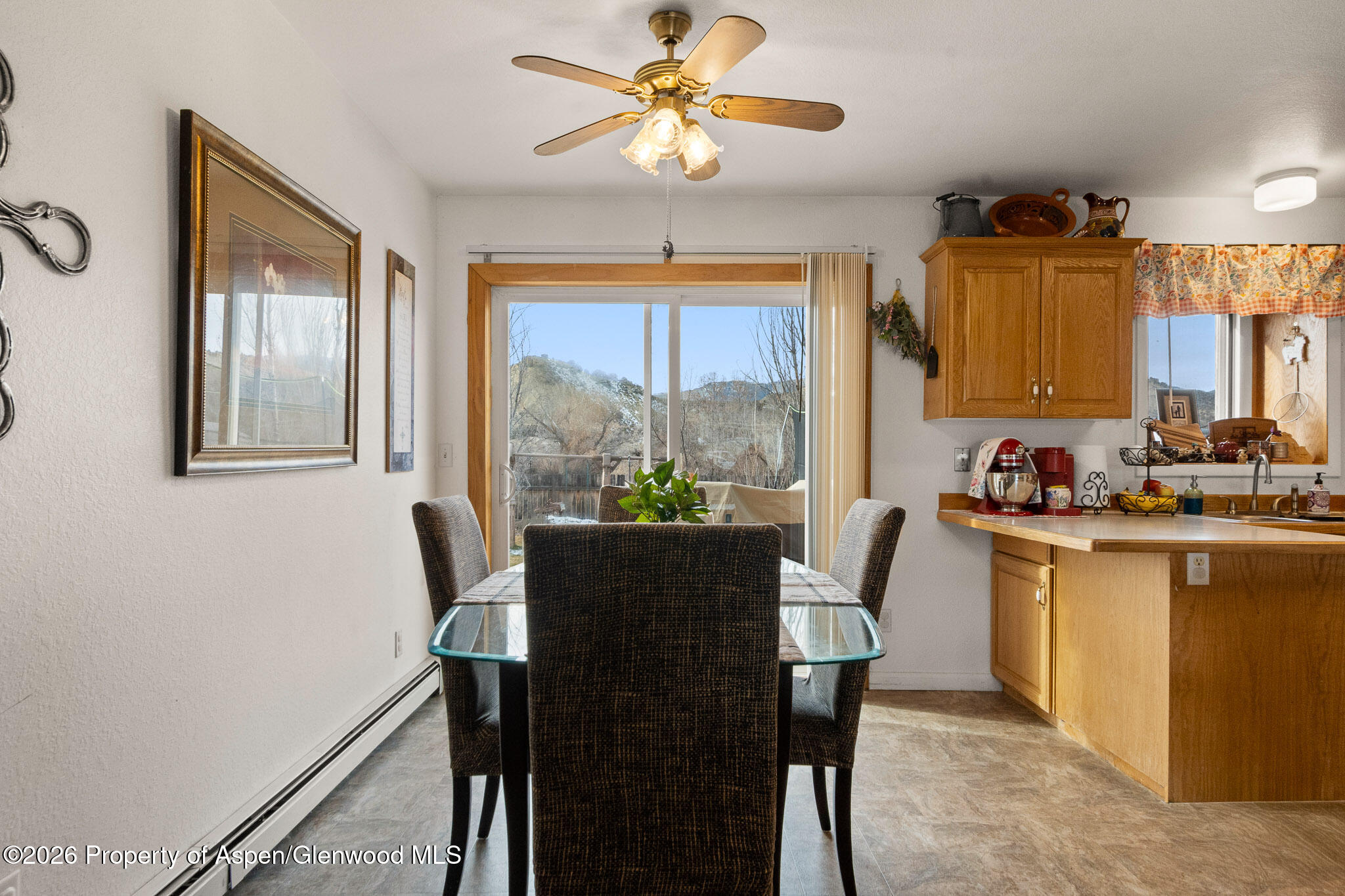 3127 Coal Mine Avenue Rifle, CO 81650 - Photo 7 of 21 a view of a dining room with furniture window and outside view