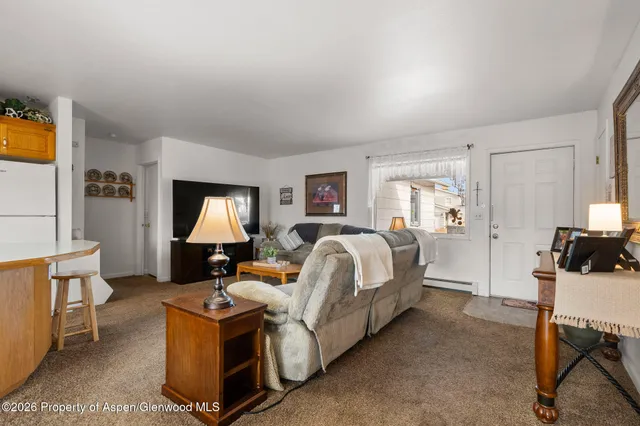 a bed room with a bed and a chair