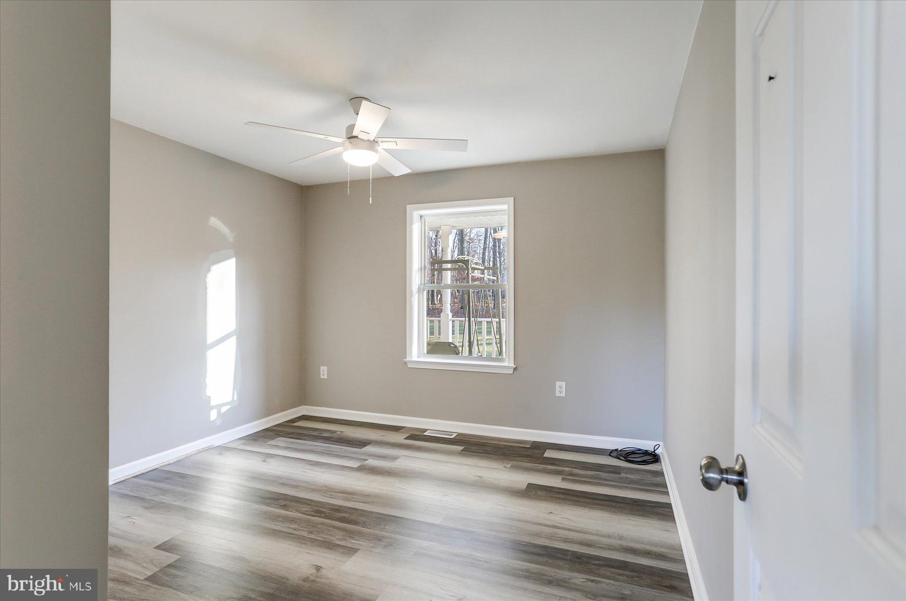 280 Miller Road Halifax, PA 17032 - Photo 20 of 34 a view of empty room with wooden floor and fan