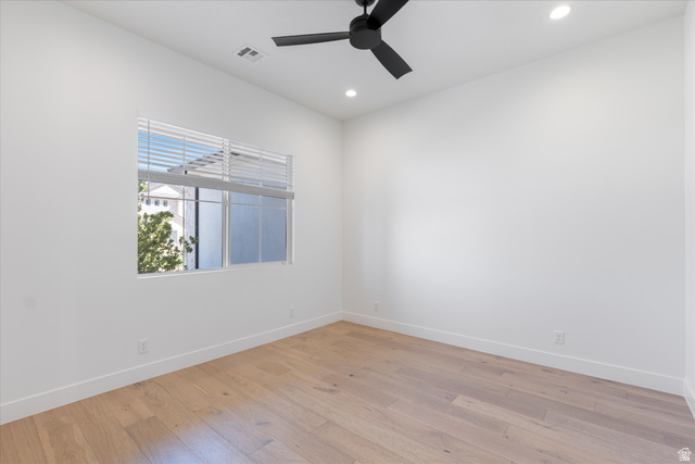 1192 East Corral Way Washington, UT 84780 - Photo 12 of 81 Bright room featuring wood-finish flooring, a contemporary black ceiling fan, recessed lighting, and a window with blinds