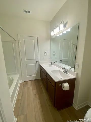 a utility room with a sink washer and dryer