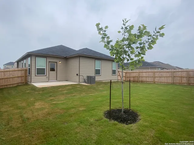 a backyard of a house with lots of green space