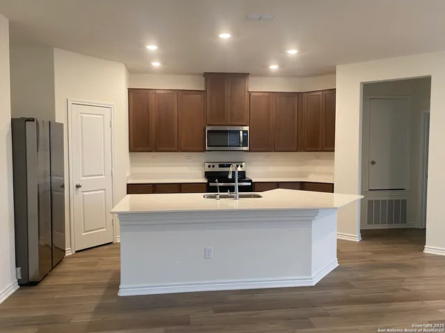 a view of kitchen with wooden floor