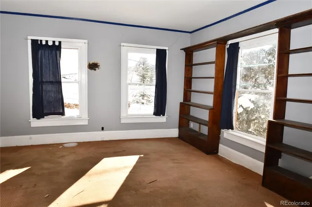 a view of a room with a white walls