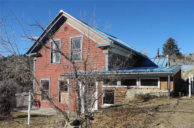 a front view of a house with garage