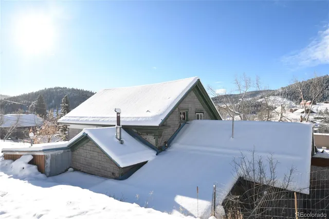 a aerial view of a house with a yard