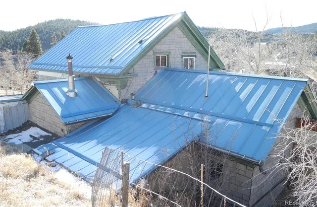 a view of a house with wooden deck