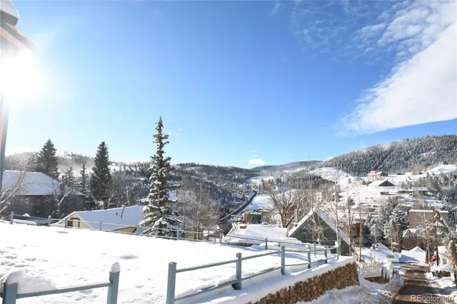a view of a backyard of snow