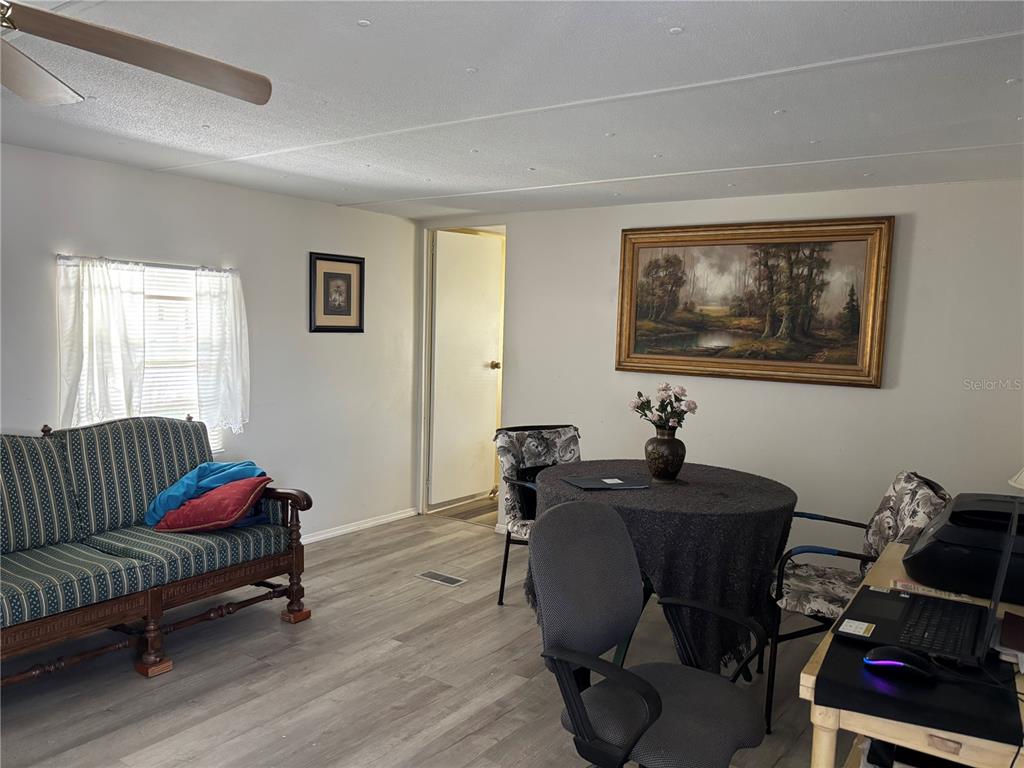 3346 Chatford Drive Holiday, FL 34690 - Photo 2 of 10 a view of a livingroom with workspace and a couch